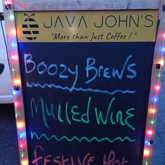 Neon sign advertising Java John's Boozy Brews & Mulled Wine