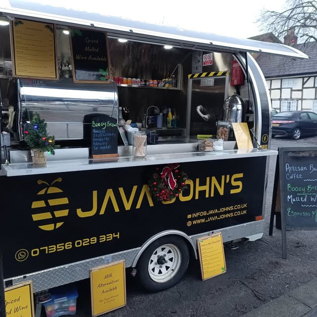 Java John's branding and bee logo on the van