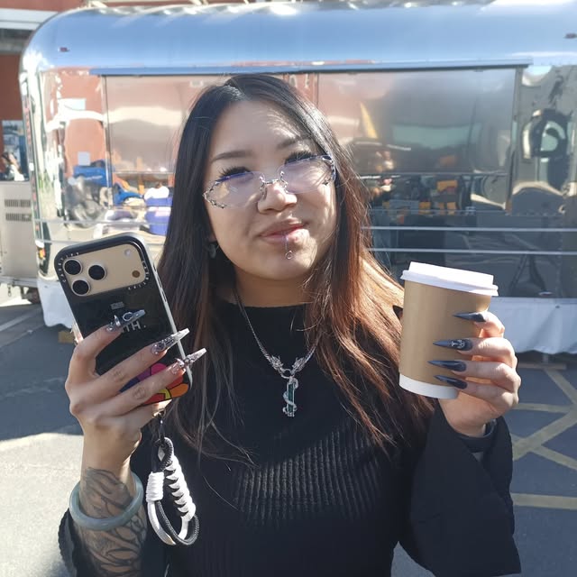 A happy customer with a Java John's coffee